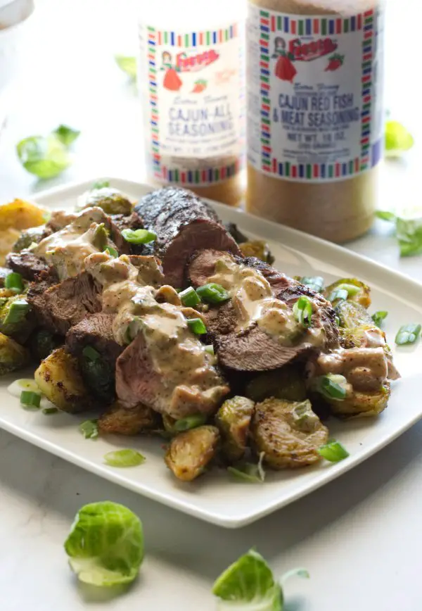 Blackened Venison Tenderloin plated with Cajun Cream Sauce