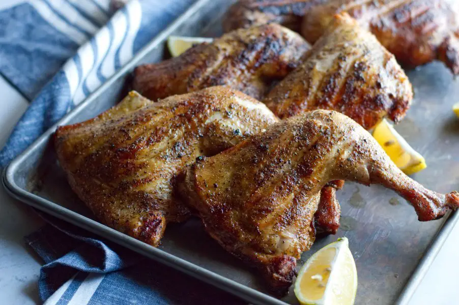 BBQ Chicken Leg Quarters on Pan with Lemons